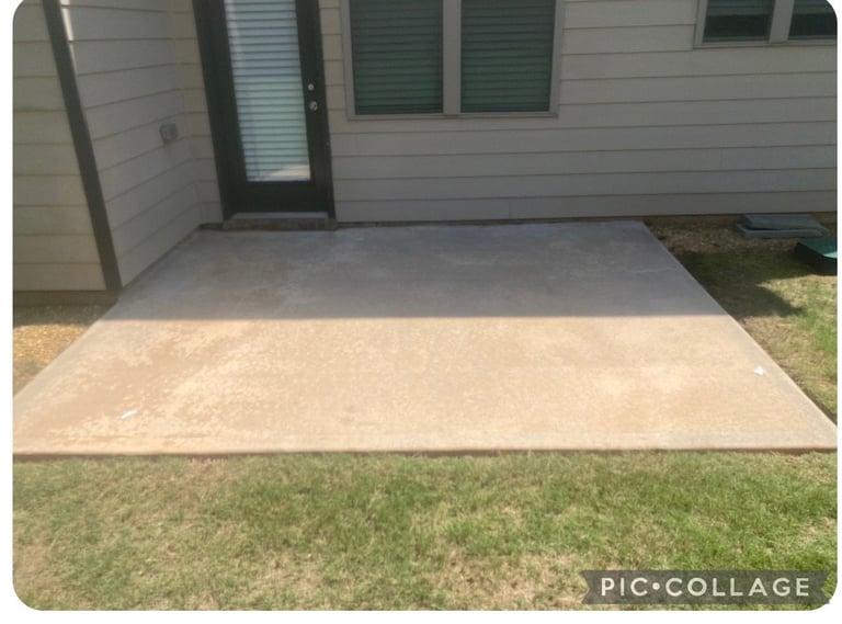 Concrete patio adjacent to white house siding with green windows and surrounding lawn