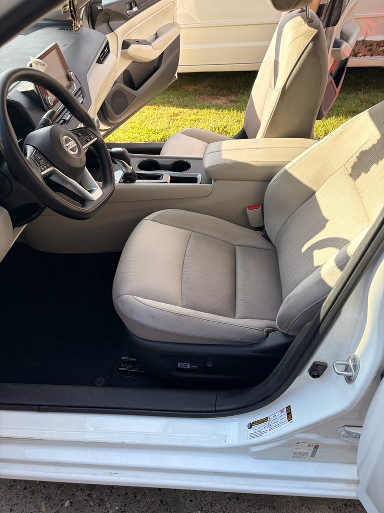 Clean white convertible interior with tan leather seats